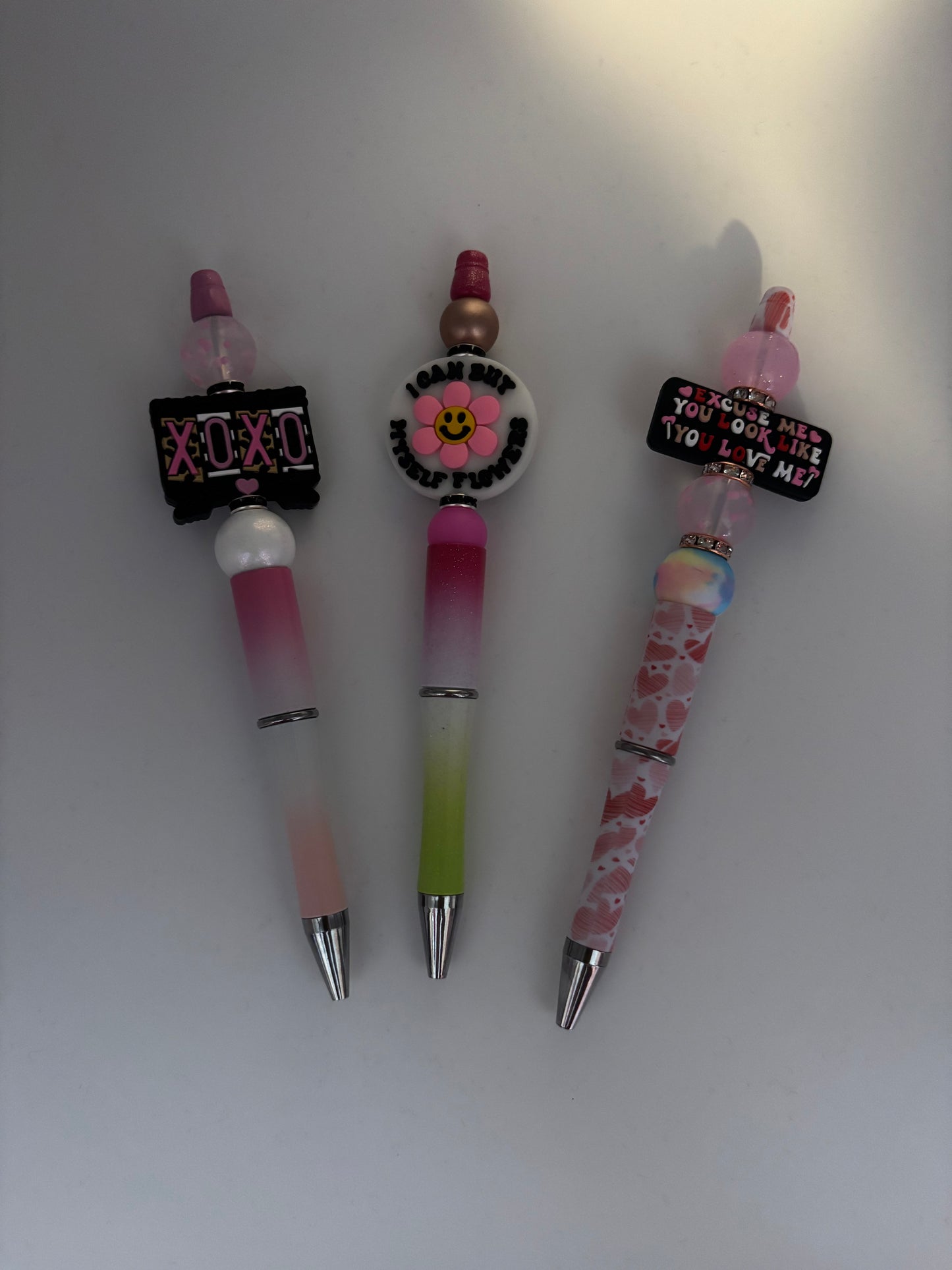 Pens, bookmarks and focal keychains